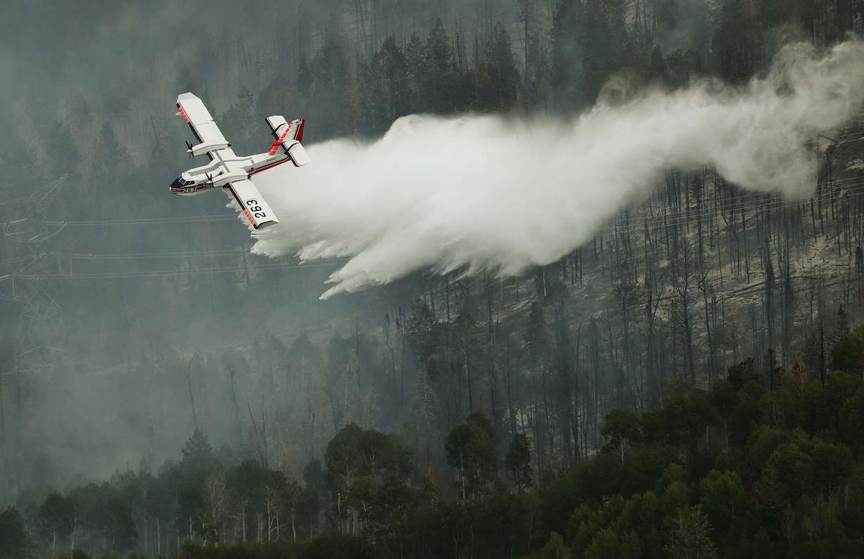 A Super Scooper drops water on the Dollar Ridge Fire near Strawberry Reservoir on Friday, July 6, 2018. (Photo: Jeffrey D. Allred, KSL)