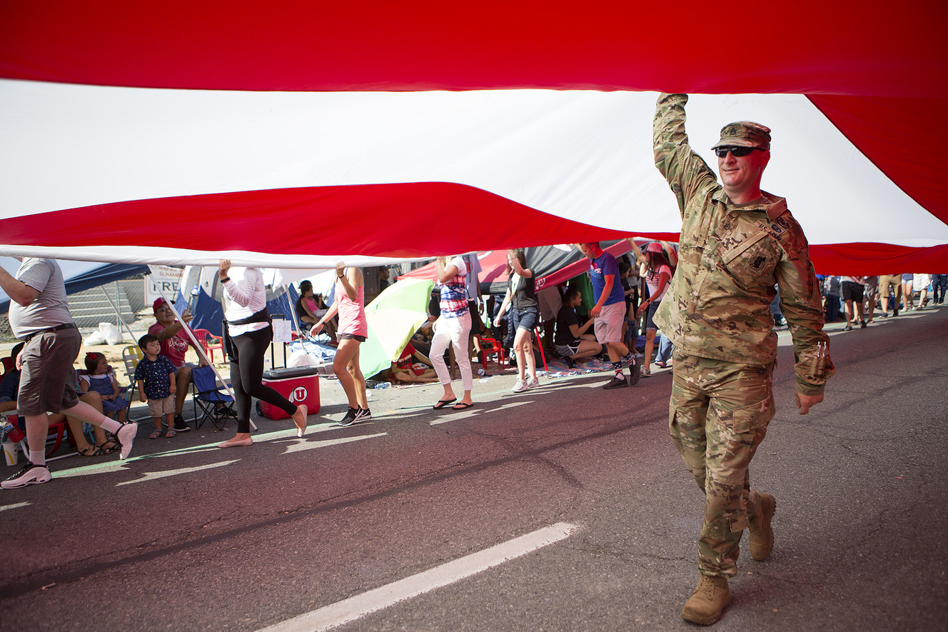 Army Sgt. Ben Winn helps carry Follow the Flag, the largest free flying American flag in the world, during the Days of '47 Parade in Salt Lake City on Tuesday, July 24, 2018. (Photo: James Wooldridge, KSL)