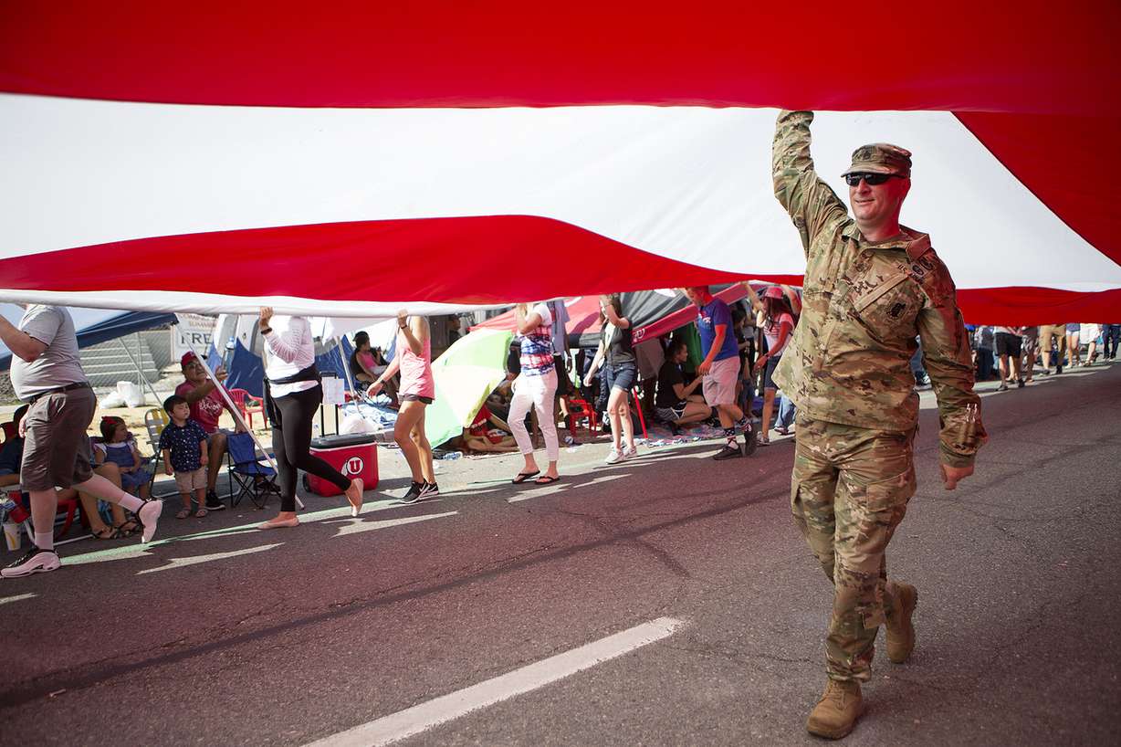 Army Sgt. Ben Winn helps carry Follow the Flag, the largest free flying American flag in the world, during the Days of '47 Parade in Salt Lake City on Tuesday, July 24, 2018. (Photo: James Wooldridge, KSL)
