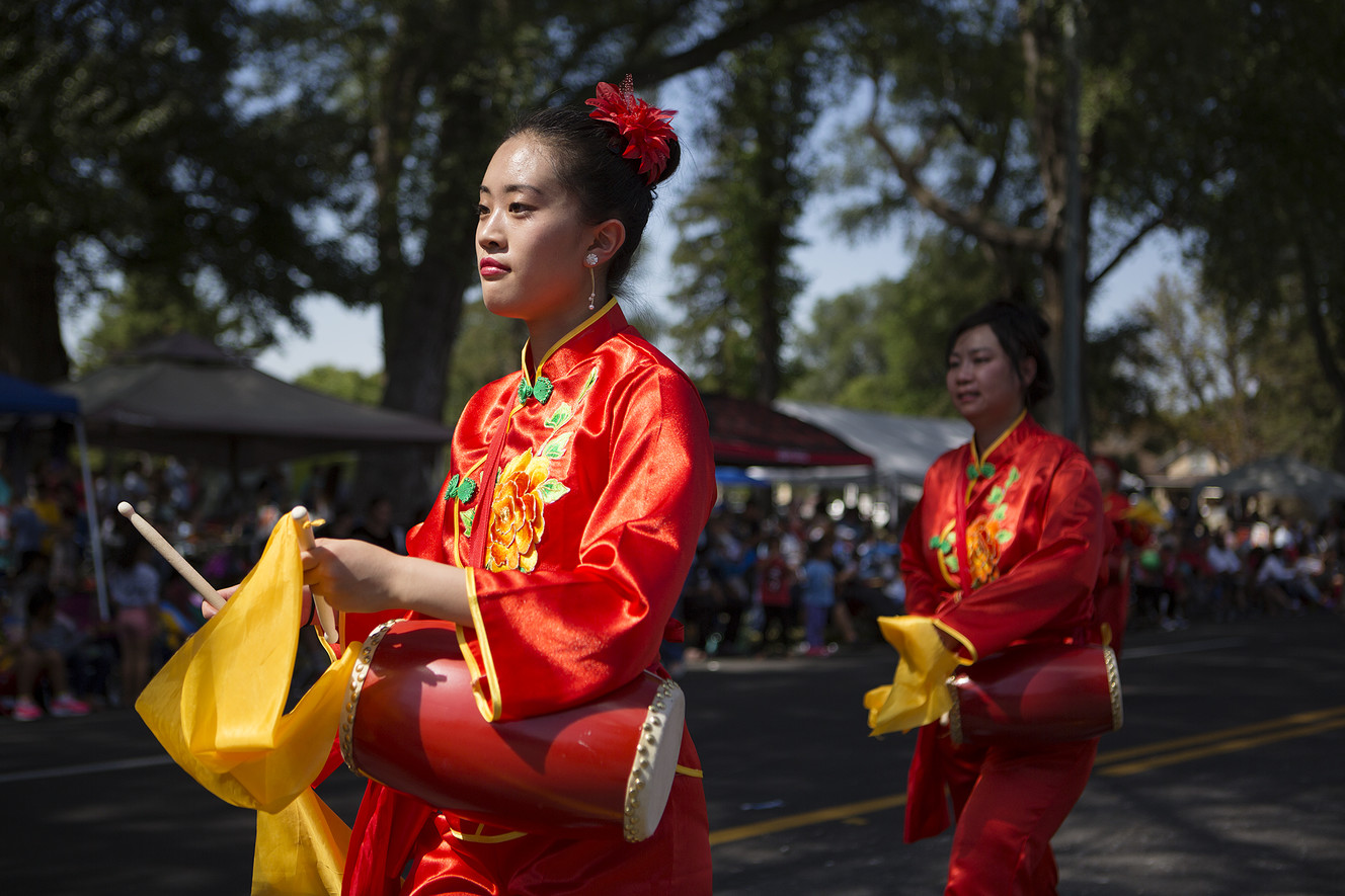 Joanna Wang, left, with the Utah China Association, marches in the Days of '47 Parade in Salt Lake City on Tuesday, July 24, 2018. (Photo: James Wooldridge, KSL)