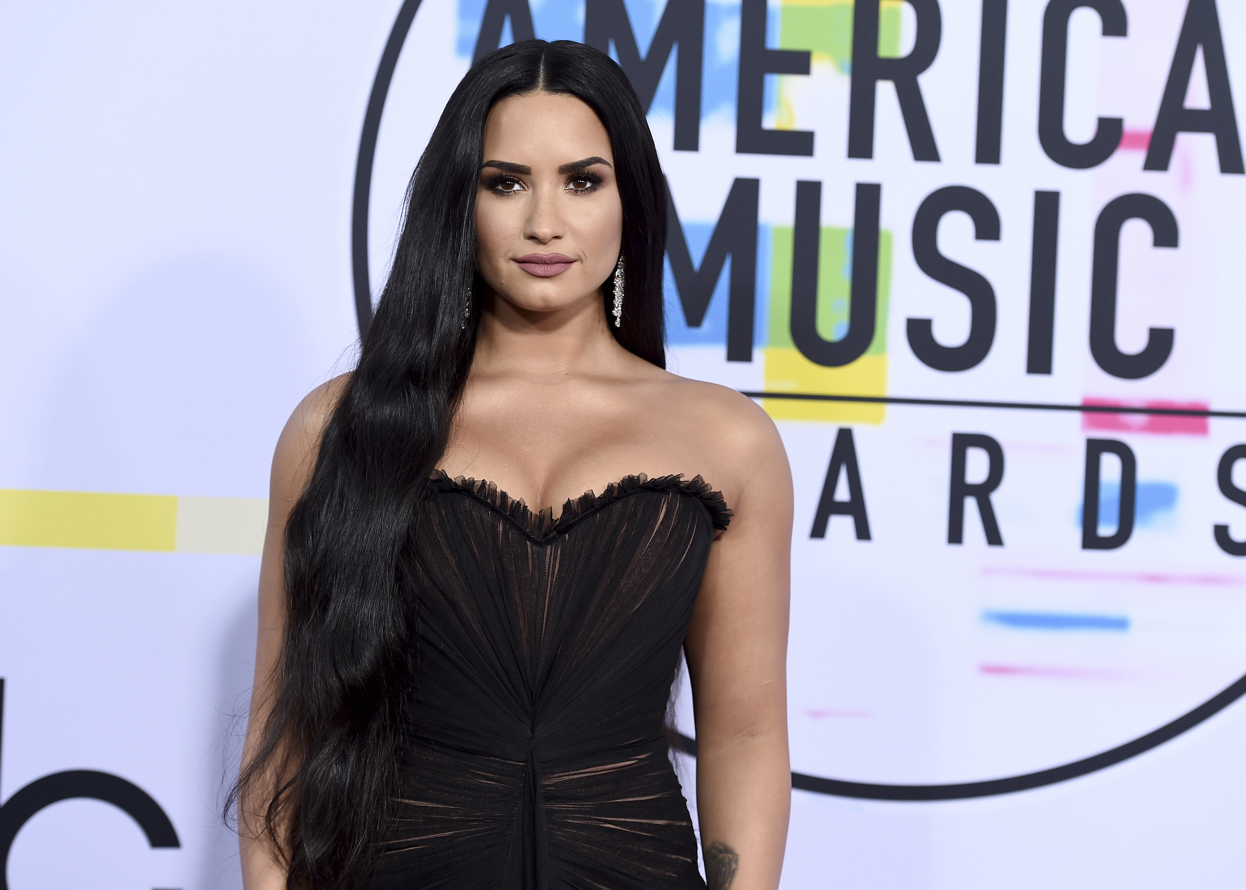 The Latest: Lovato rep says singer is awake and with family