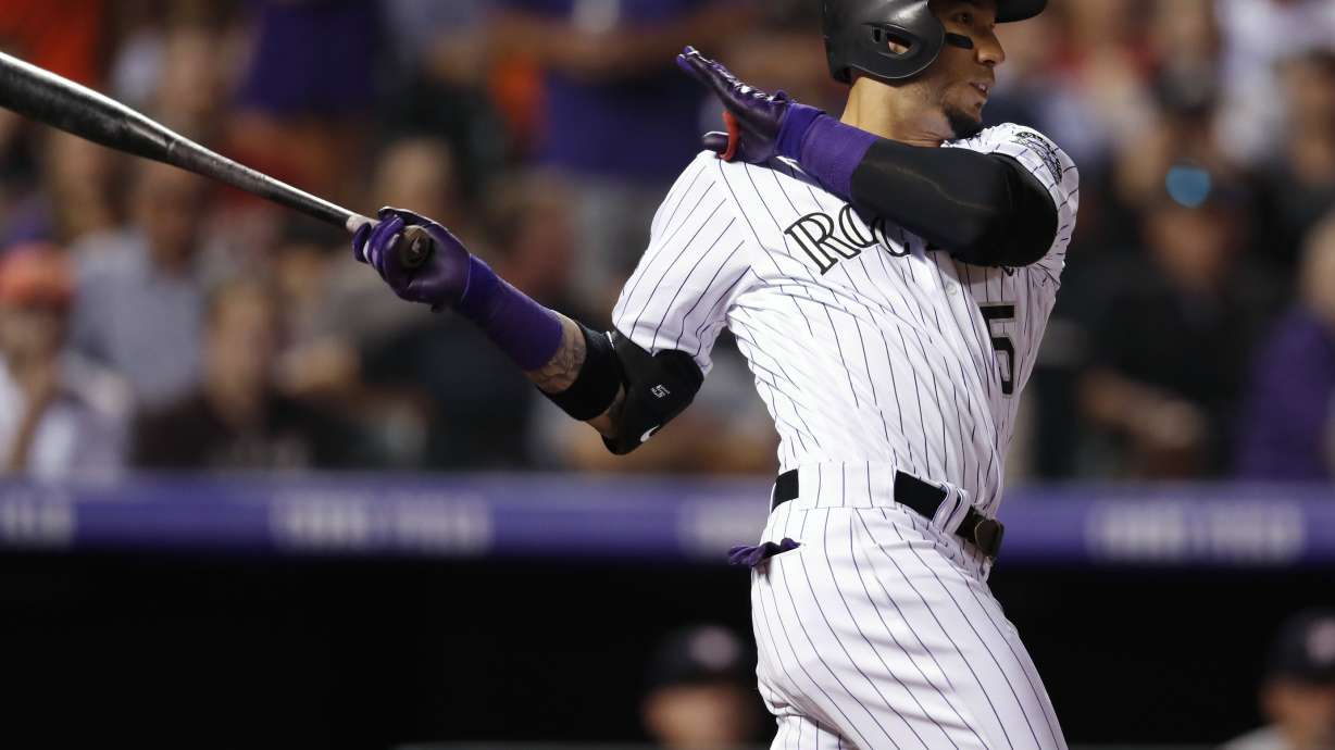 Astros erupt for 6 runs in 10th, beat Rockies 8-2