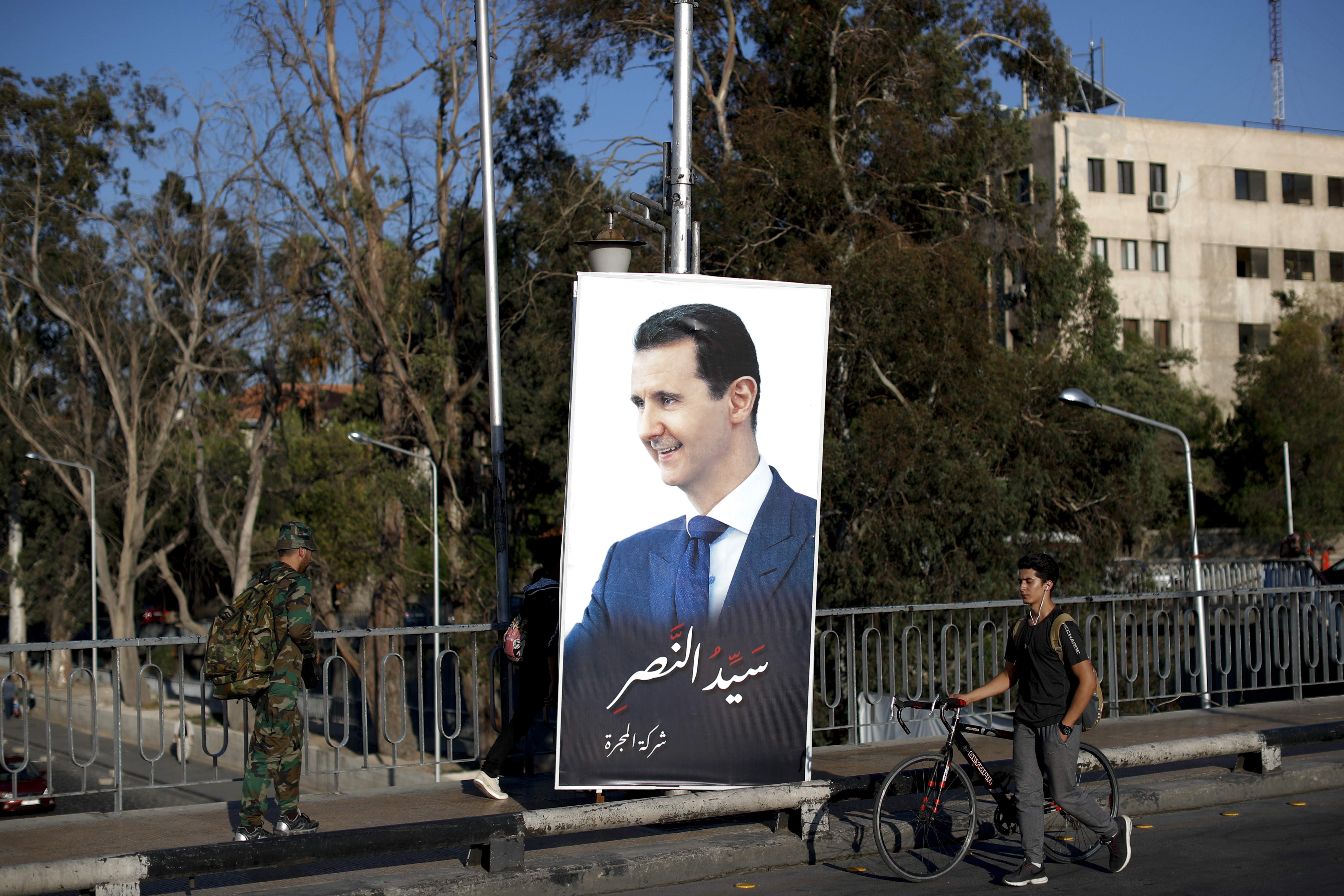 AP PHOTOS: Assad's victory posters crowd Damascus streets