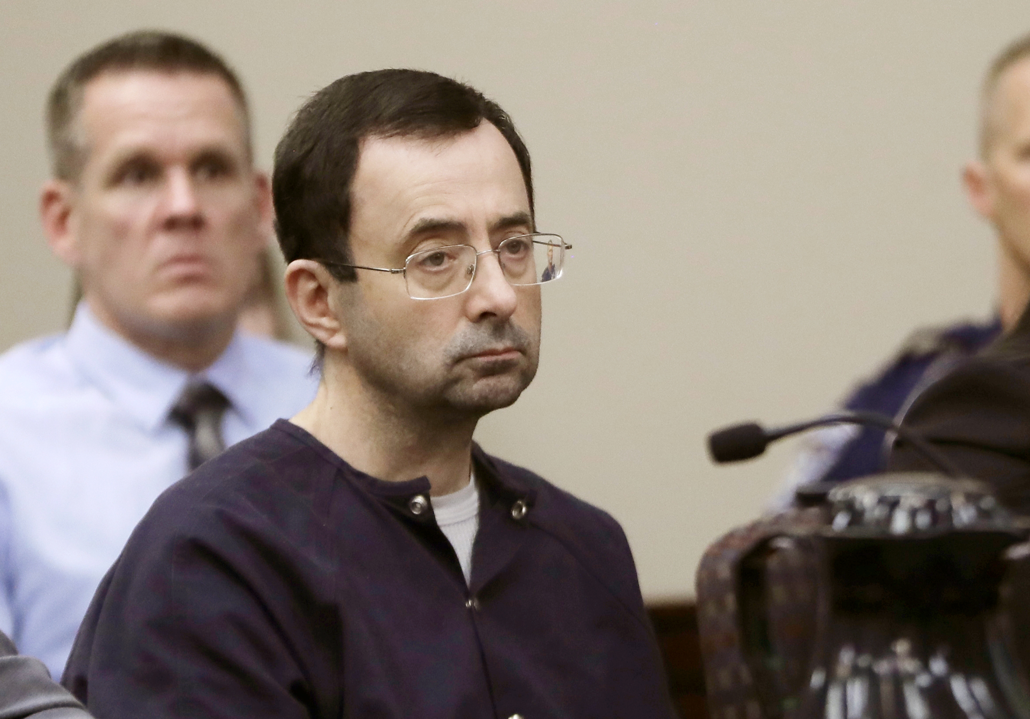 The Latest: Nassar lawyers say he was assaulted in prison