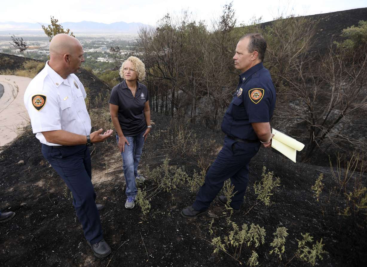 Salt Lake City Fire Chief Karl Lieb, Salt Lake City Mayor Jackie Biskupski and Salt Lake City Fire District Capt. John Kartsone, who managed the incident, tour an area that burned near Ensign Peak Tuesday in Salt Lake City on Wednesday, July 25, 2018. (Photo: Kristin Murphy, KSL)