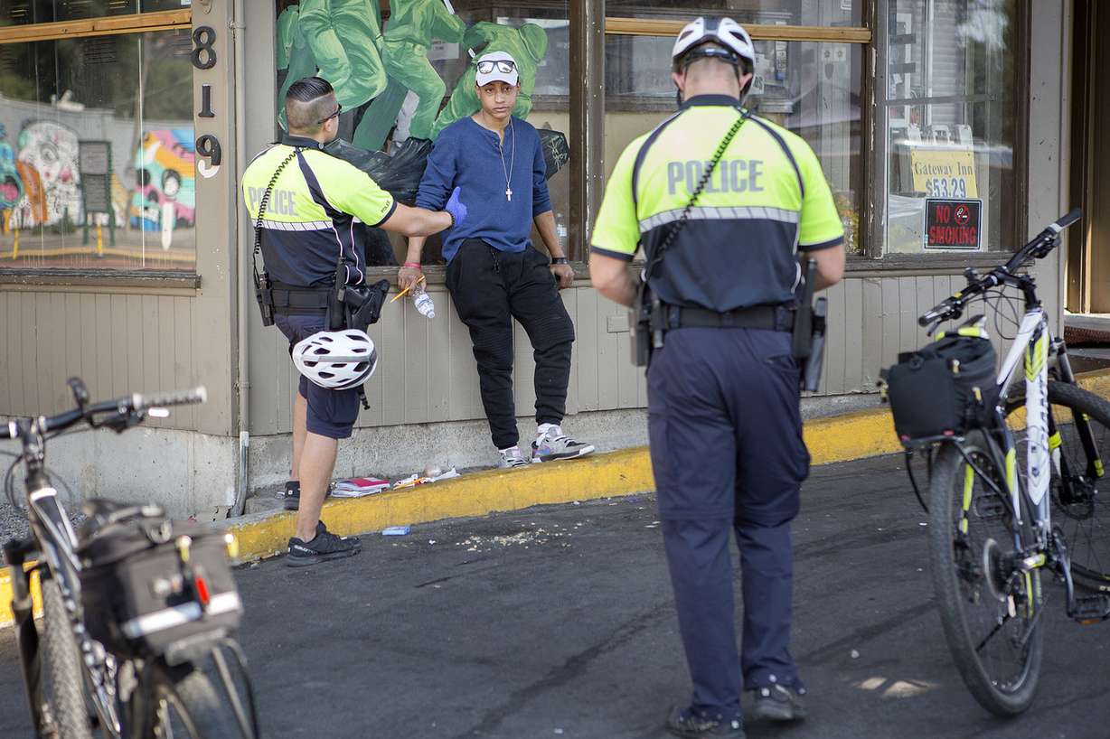 Officers Wilson Silva, right, and W. Sackett talk to a person at the Gateway Inn, located next to a new police bike patrol substation on North Temple in Salt Lake City on Wednesday, July 25, 2018. Police get calls from the inn often, according to Salt Lake City Police Sgt. Robert Ungricht. (Photo: James Wooldridge, KSL)