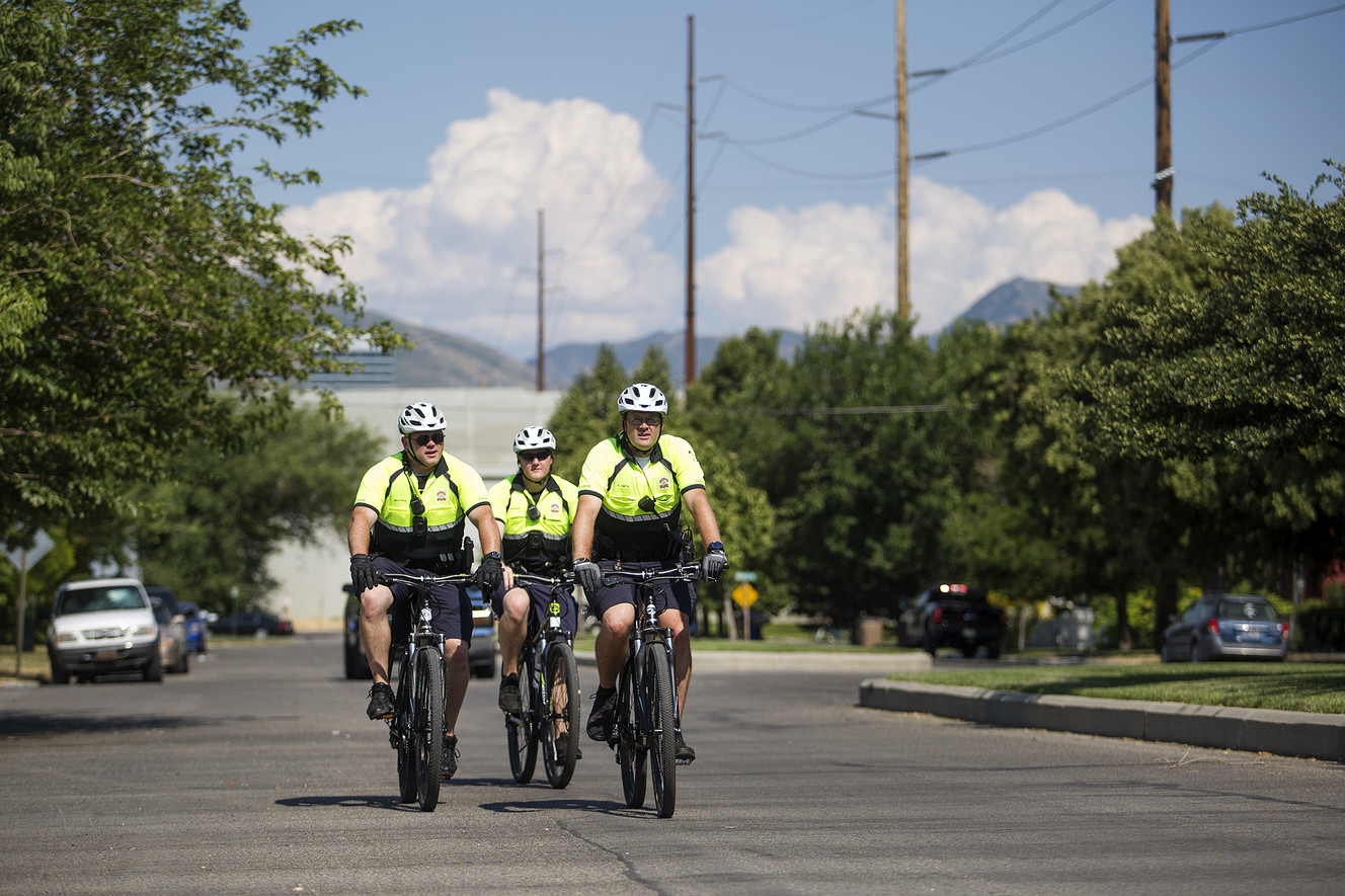 Officers Kris Smith, right, Nathan Meinzer and Stephen Masters ride down 100 South in Salt Lake City, two blocks from a new police bike patrol substation on North Temple on Wednesday, July 25, 2018. (Photo: James Wooldridge, KSL)