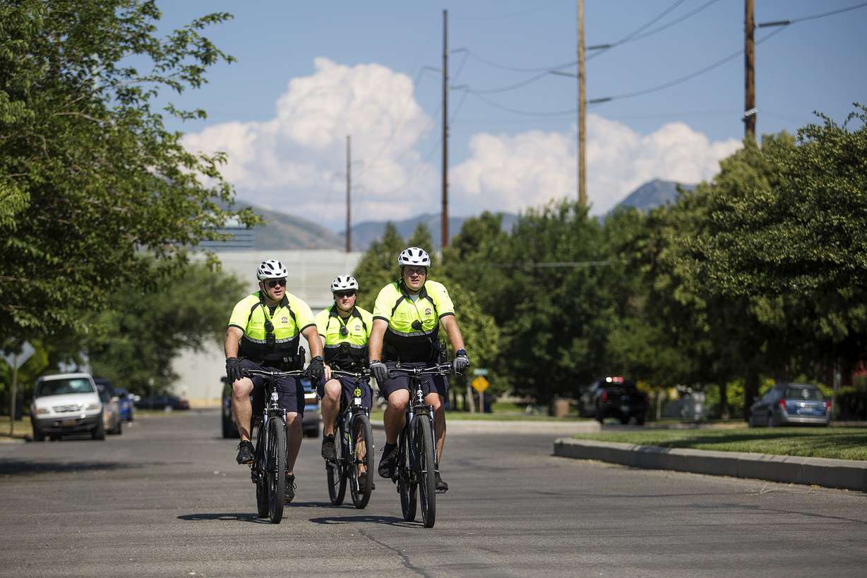 Officers Kris Smith, right, Nathan Meinzer and Stephen Masters ride down 100 South in Salt Lake City, two blocks from a new police bike patrol substation on North Temple on Wednesday, July 25, 2018. (Photo: James Wooldridge, KSL)