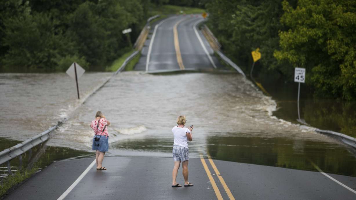 The Latest: Coroner blames man's drowning death on flooding