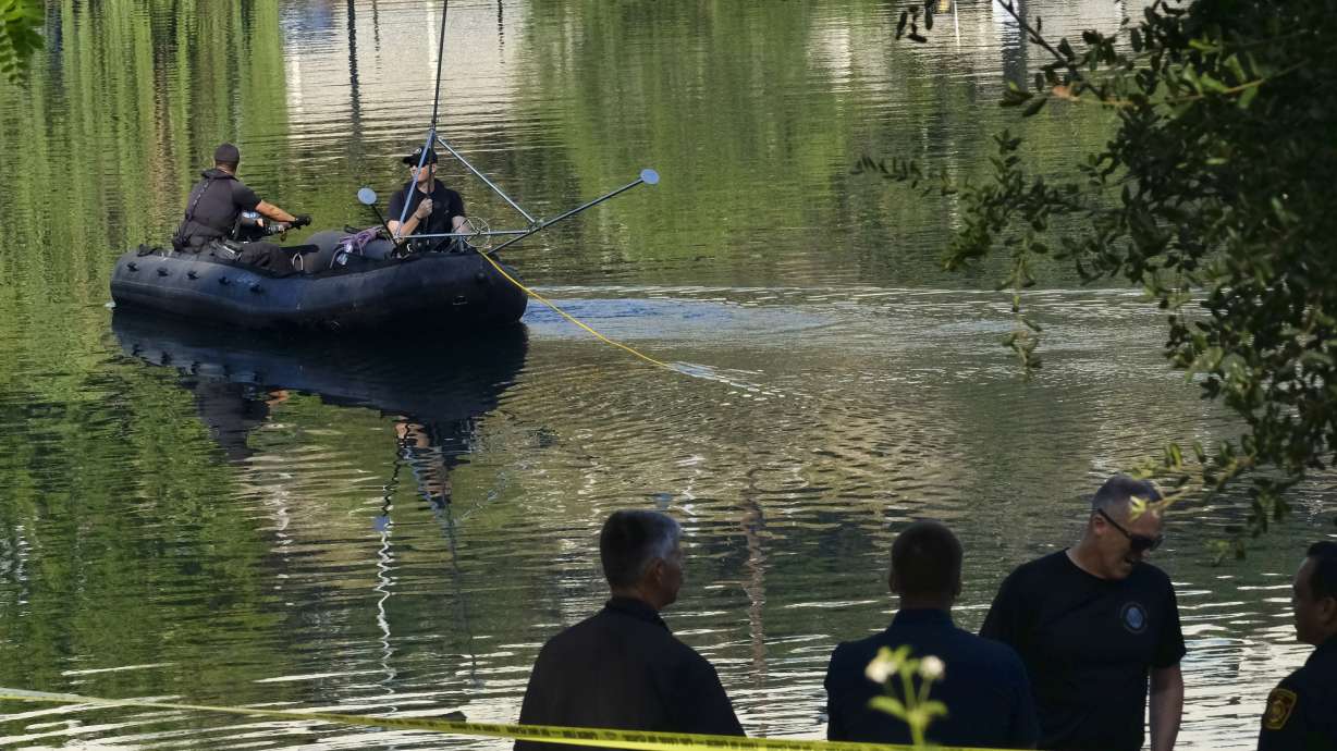 The Latest: Body found in LA lake where paddle boat capsized