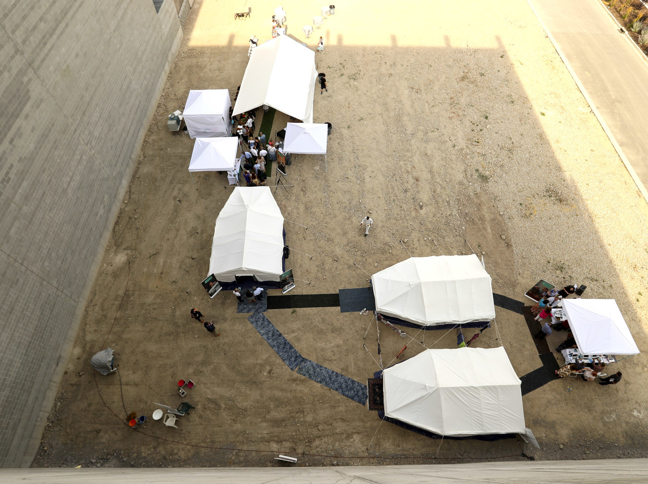 To celebrate its 25th anniversary, AMAR, an international charity supporting refugees, simulated what it is like to be in a refugee camp in a display next to the Hale Center Theatre in Sandy on Thursday, July 26, 2018. The camp consisted of three large tents with immigrants from Iraq, who now are living in Utah, an Invest Center where individuals learn skills like using a computer, sewing and hair care, and a dinning tent where guests experienced food from the region. (Photo: Steve Griffin, KSL)