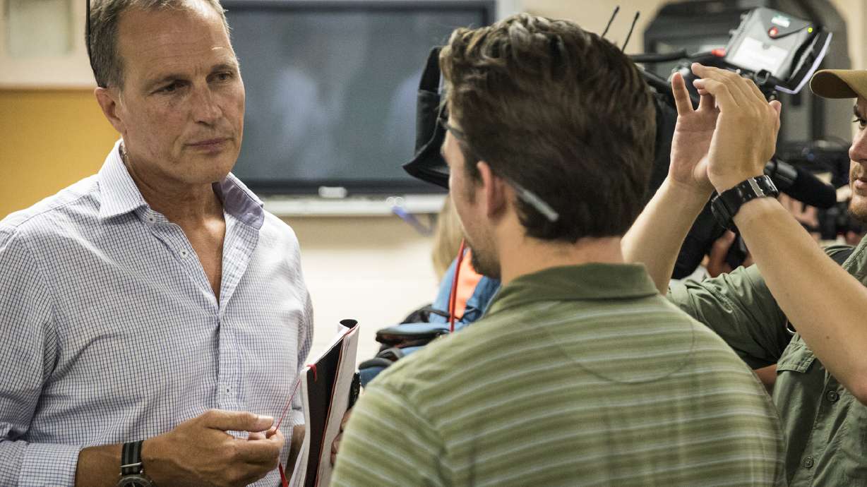 The Latest: 3,000 cases of water given away after PFAS found