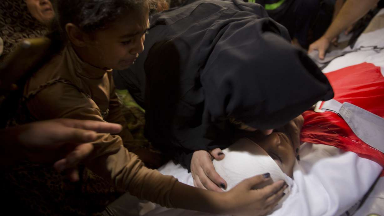 Thousands bury 11-year-old, 2 others killed by Israeli fire