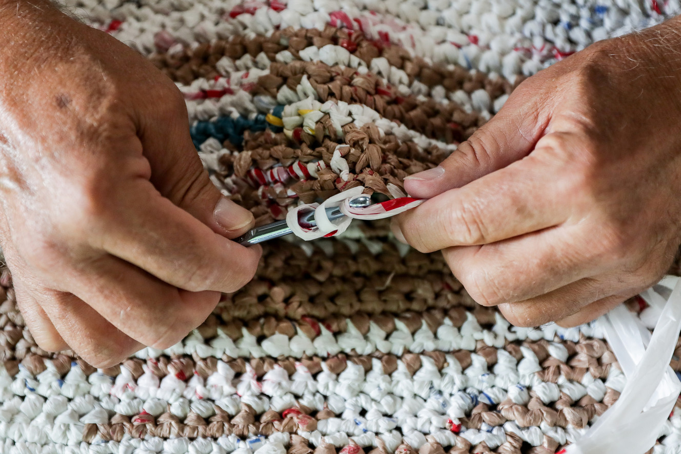 Joseph Reese crochets plastic grocery bags into sleeping pads for homeless individuals at Canyon Rim Park in Millcreek on Saturday, July 28, 2018. Members of the Canyon Rim neighborhood of Millcreek gathered for three days of service projects. (Photo: Spenser Heaps, KSL)