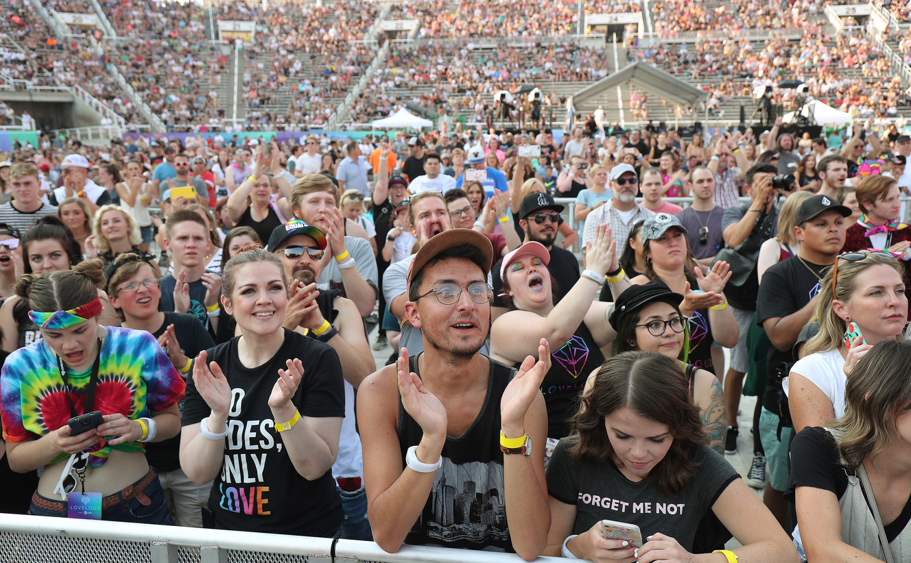 Attendees listen to music during the LoveLoud music festival in Salt Lake City on July 28, 2018.  On Wednesday, organizers of the music festival, which benefits LGBTQ youth and was organized by Imagine Dragons' Dan Reynolds, will be back in 2022 after a three-year hiatus. 