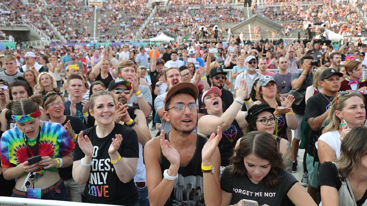 Attendees listen to music during the LoveLoud music festival in Salt Lake City on July 28, 2018. On Wednesday, organizers of the music festival, which benefits LGBTQ youth and was organized by Imagine Dragons' Dan Reynolds, will be back in 2022 after a three-year hiatus.