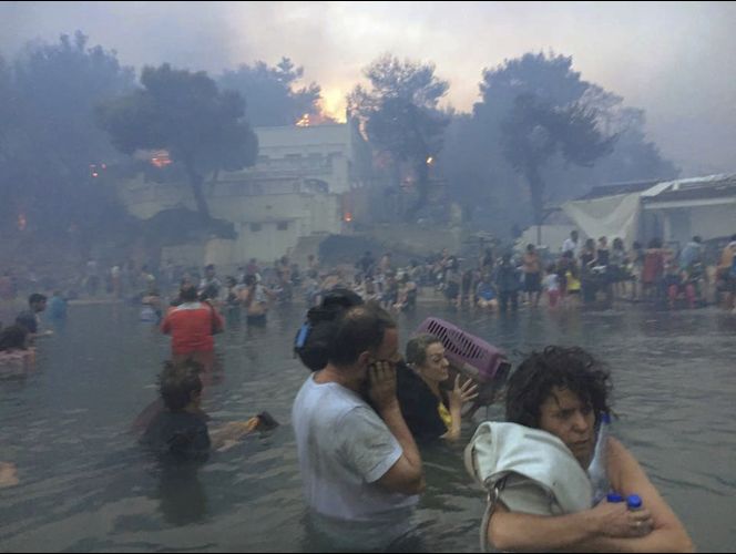 Death toll from Greek wildfire reaches 91 as village grieves