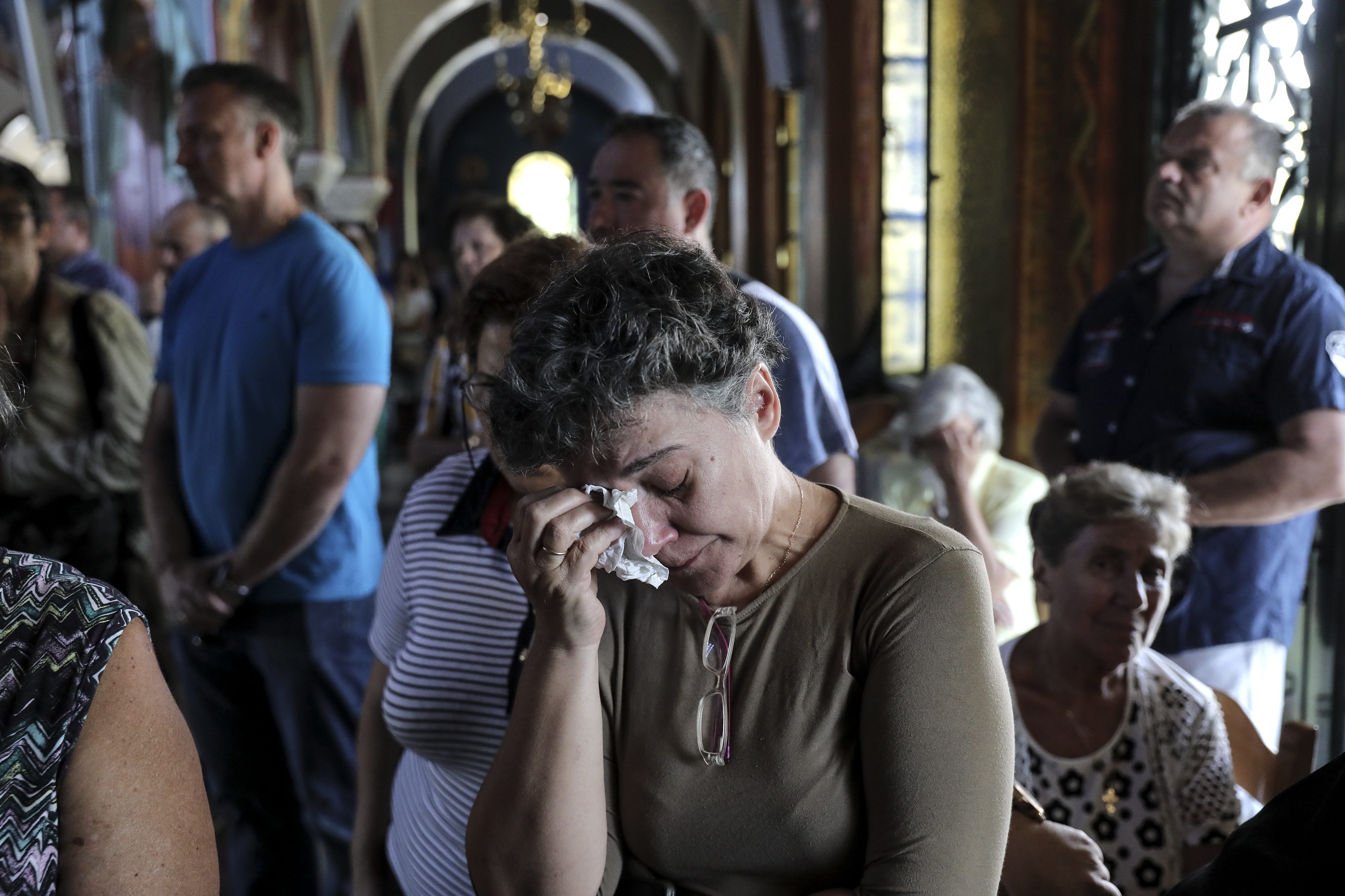 Death toll from Greek wildfire reaches 91 as village grieves