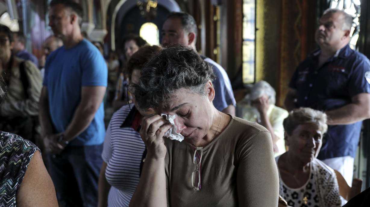 Death toll from Greek wildfire reaches 91 as village grieves