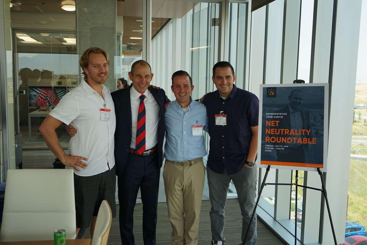 Rep. John Curtis (second to left) and Mainframe CEO Mick Hagen (far right) pose for a picture with other meeting participants after Curtis' net neutrality roundtable at the Adobe building in Lehi Tuesday. The group discussed ways to move forward with the controversial issue. Photo: Courtesy of John Curtis' office