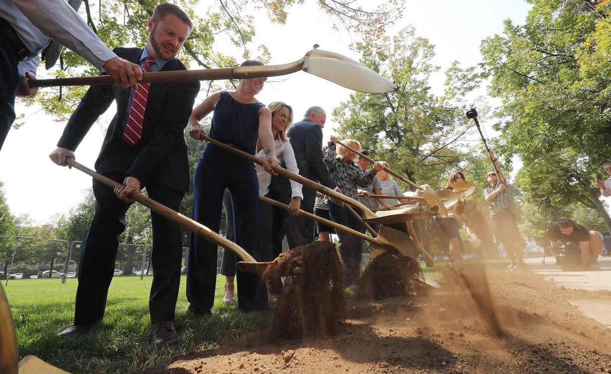 Dignitaries break ground for new project at Pioneer Park in Salt Lake City on Wednesday, Aug. 1, 2018. The city will install a large lawn in the south-central portion of the park that will include a surrounding walkway, sports field and sports lighting. The construction will allow for events such as evening soccer leagues and concerts in the park. The Pioneer Park Coalition is contributing $300,000 toward construction. (Photo: Jeffrey D. Allred, KSL)