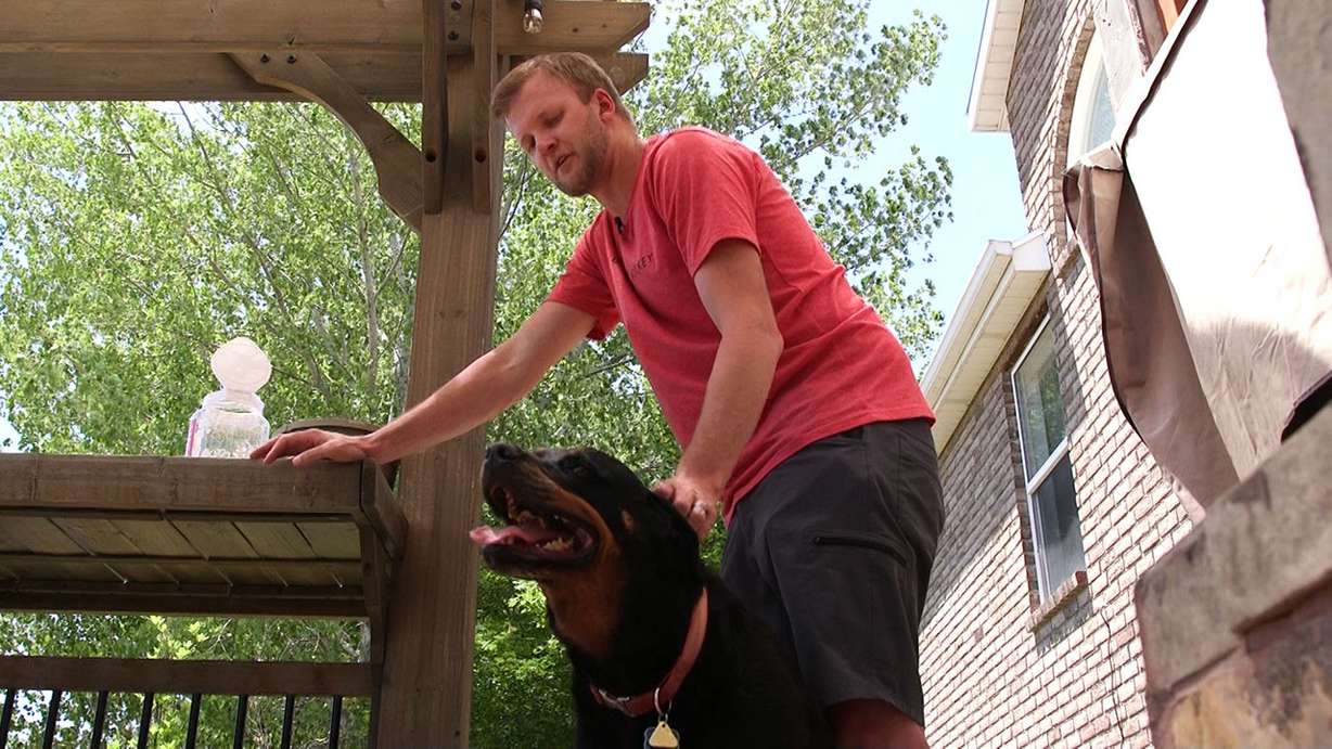 South Jordan resident Taylor Sanford and his Rottweiler named Titan, Thursday, Aug. 2, 2018. Photo: KSL TV