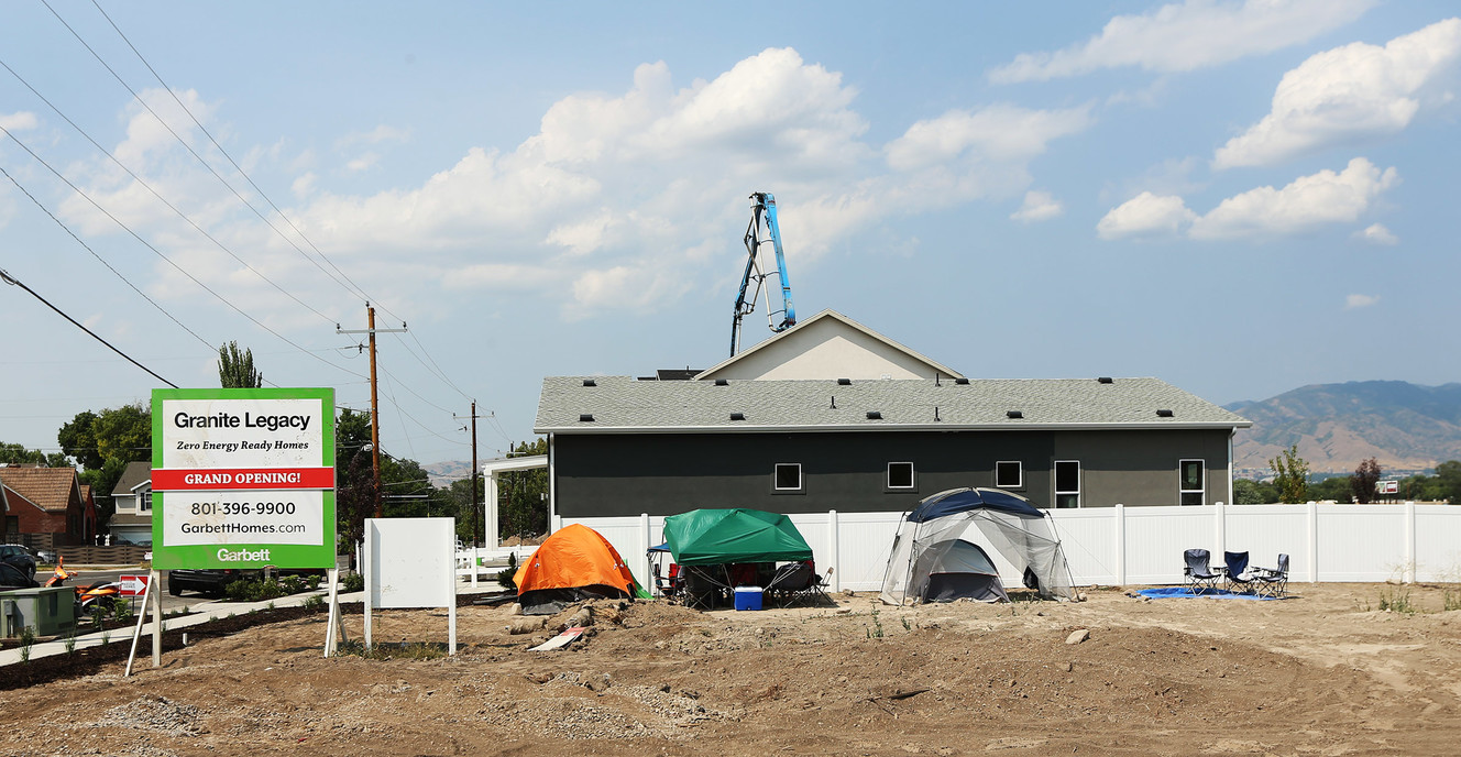 People camp out in tents on the former Granite High School property in South Salt Lake on Friday, Aug. 3, 2018. Eager homebuyers camped out in anticipation of a chance to buy one of the single-family homes on the former Granite High School property. (Photo: Scott G Winterton, KSL)