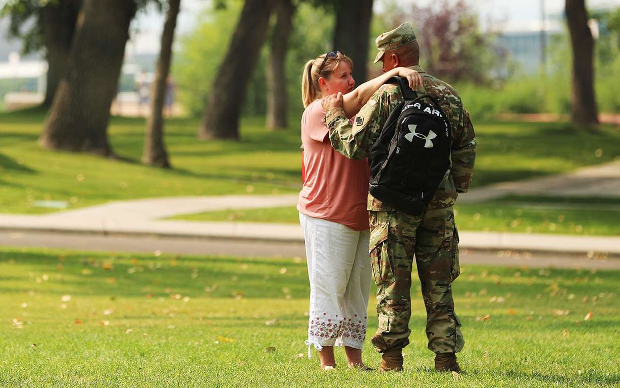 Carolyn and Nelson Maldonado talk to each other after members of the 191st Combat Sustainment Support Battalion took part in a deployment farewell ceremony at Fort Douglas in Salt Lake City on Saturday, Aug. 4, 2018. (Photo: Scott G Winterton, KSL)