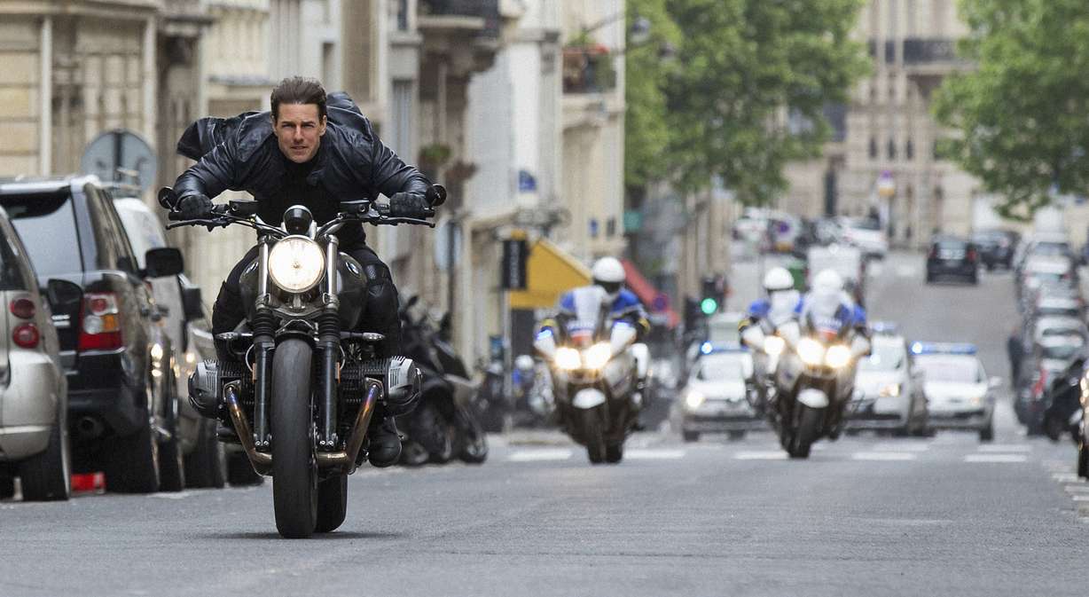 This image released by Paramount Pictures shows Tom Cruise in a scene from "Mission: Impossible - Fallout." Tom Cruise has outrun Winnie-the-Pooh at the box office. “Mission: Impossible -- Fallout” topped ticket sales for the second straight weekend with an estimated $35 million despite newcomer “Christopher Robin.” According to studio estimates Sunday, Aug. 5, 2018, the sixth “Mission: Impossible” installment has amassed $124 million in its first 10 days of release. (Chiabella James, Paramount Pictures and Skydance via AP, File)