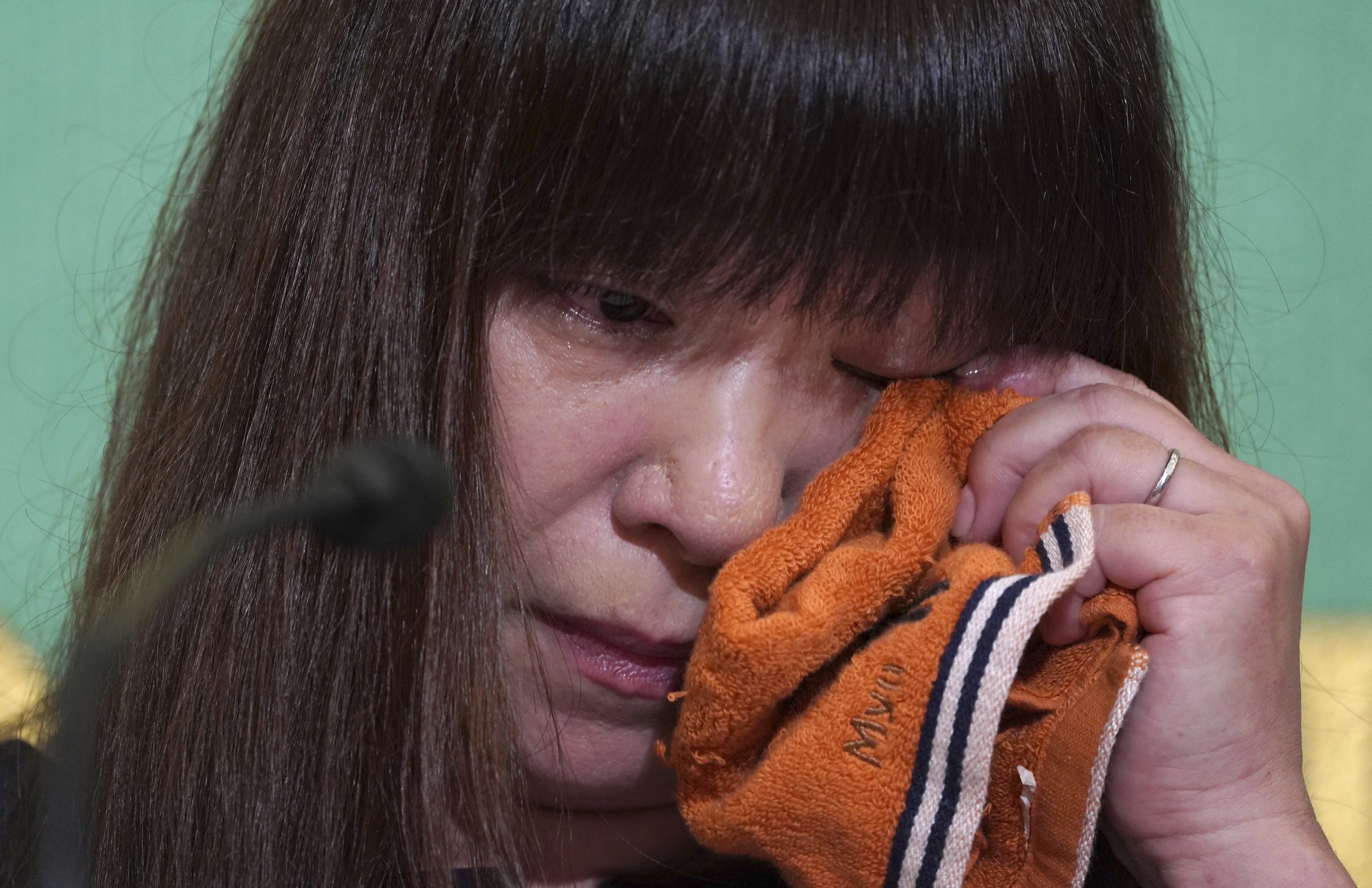 Wife of missing Japanese journalist makes tearful appeal