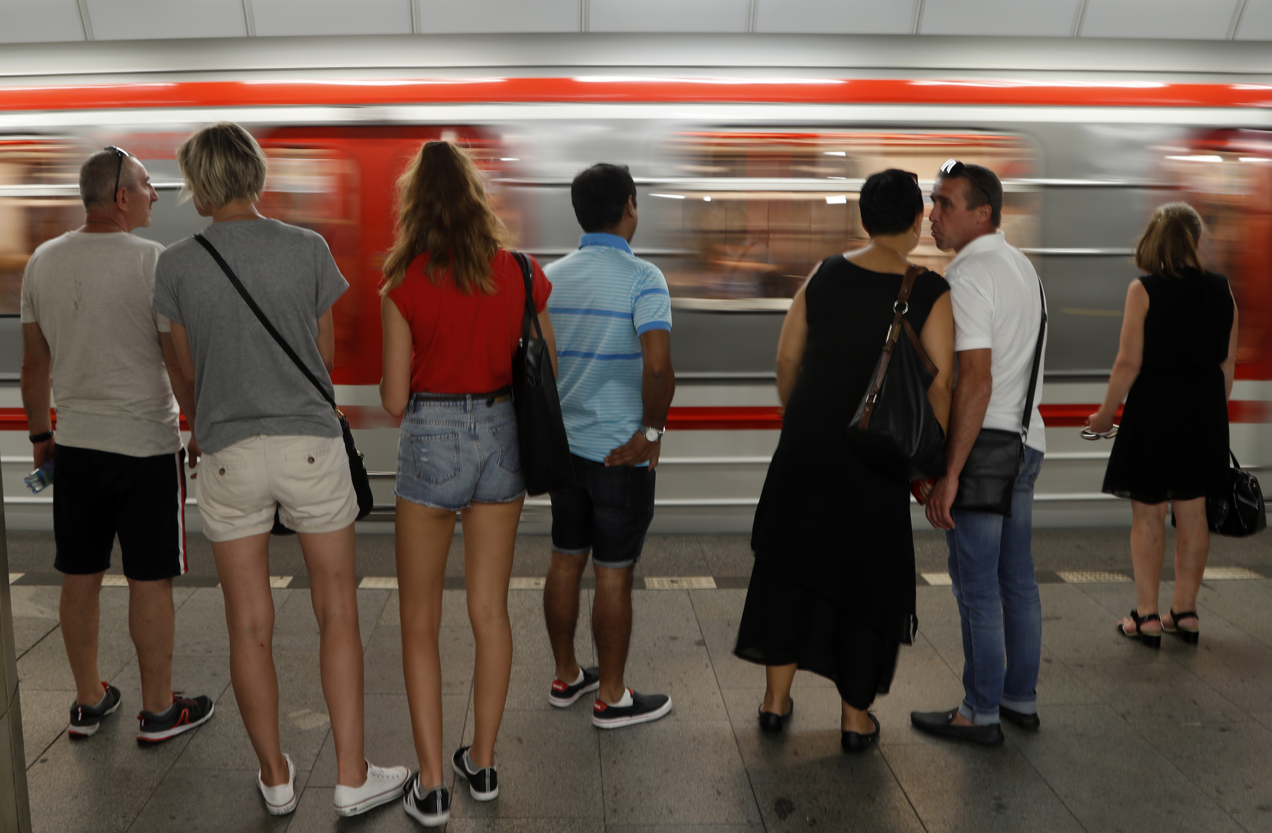 Participants in travel race drive Prague subway train