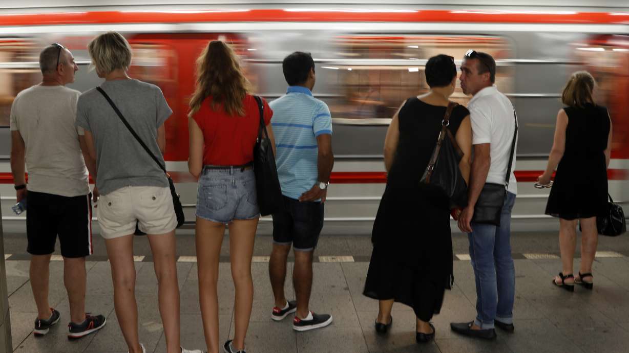 Participants in travel race drive Prague subway train