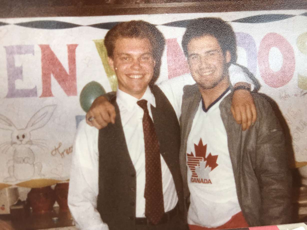 Mike Park, right, wearing his prized Bingham High School Class of 1981 class ring. He lost it in the depths of Bear Lake after he ventured onto the water during a family trip in 1984. (Photo: Adam Sotelo, KSL TV)