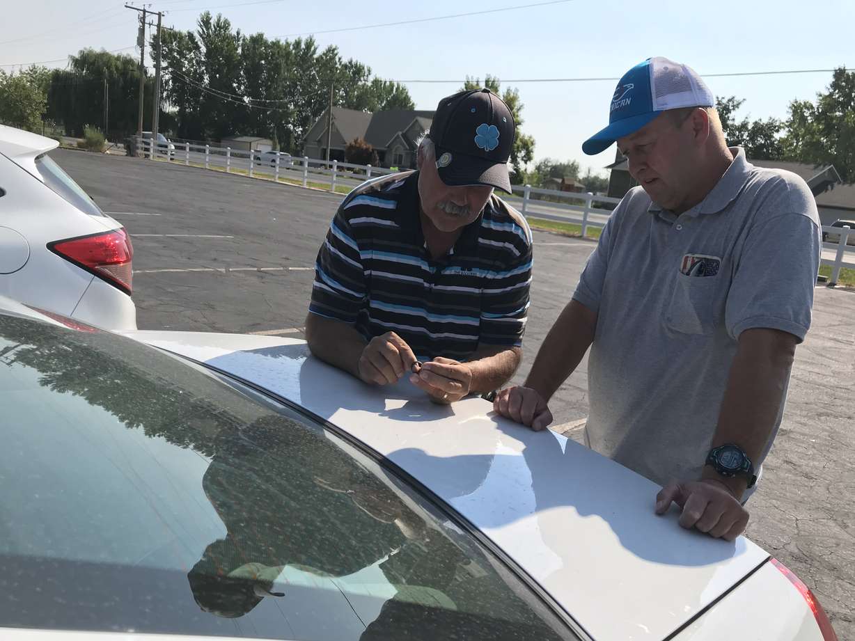 Neil Laser, left, found the class ring 3 miles away from where Mike Park (right) lost it at Bear Lake in 1984. (Photo: Adam Sotelo, KSL TV)