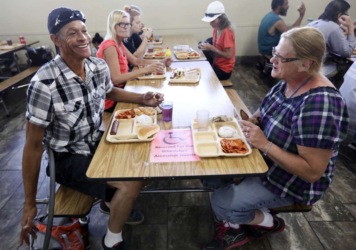 Marcus Hendricks and Pat Westlake eat lunch at Catholic Community Services of Utah’s St. Vincent de Paul Dining Hall in Salt Lake City on Wednesday, Aug. 8, 2018. (Photo: Kristin Murphy, KSL)