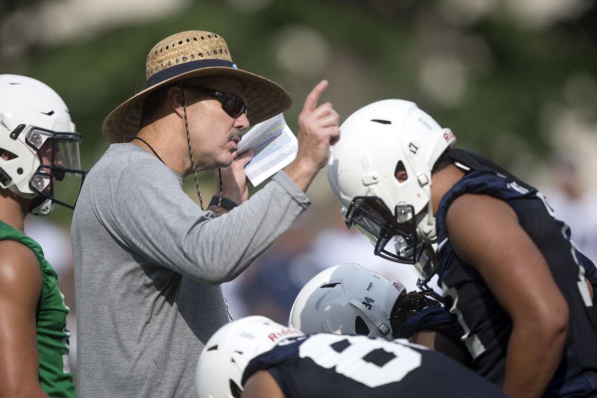 BYU offensive coordinator Jeff Grimes talks to his players during the Cougar's first football practice at BYU in Provo on Thursday, Aug. 2, 2018. Grimes was the offensive line coach at LSU when the then-No. 22 Tigers lost to Troy, 24-21 in 2017.