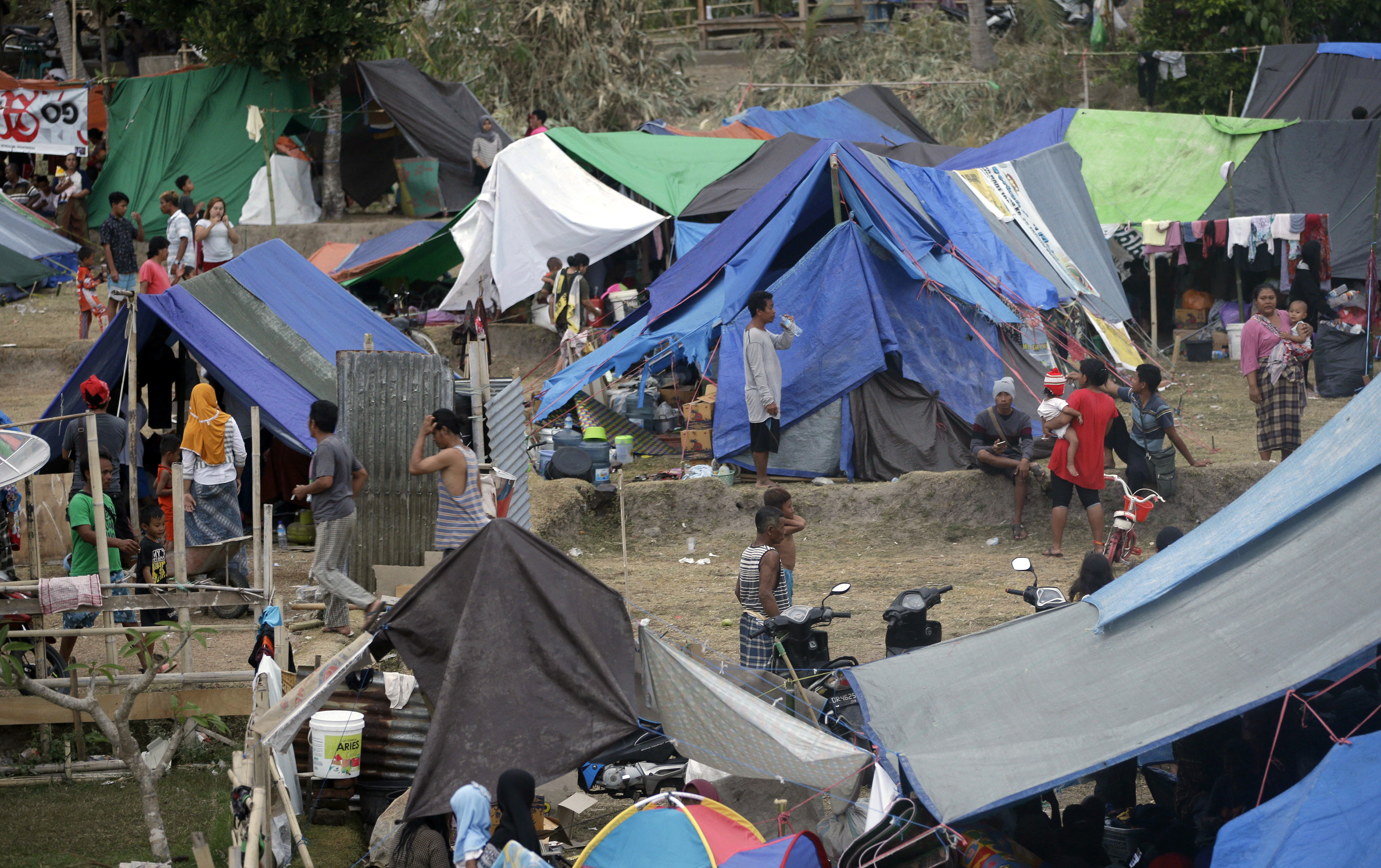 The Latest: Indonesia minister says quake deaths pass 300