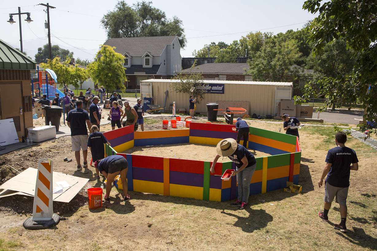 Volunteers build a new playground in South Salt Lake on Thursday, Aug. 9, 2018. The playground was based on drawings made by children in the community in June. (Photo: James Wooldridge, KSL)