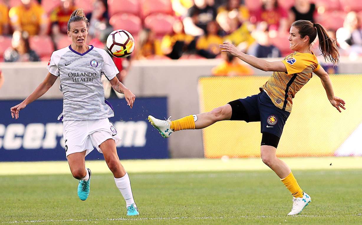 Orlando City midfielder Emily van Egmond (5) Utah Royals FC defender Kelley O'Hara (5) try to chase dow the ball as the Utah Royals and the Orlando Pride play at Rio Tinto Stadium in Sandy on Wednesday, May 9, 2018. (Photo: Scott G Winterton, Deseret News)