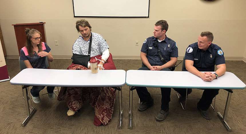 Joe Rightmire, second from left, sits next to the EMTs who came to his rescue after his truck rolled down a ravine and left him pinned for two days. Rightmire spoke publicly about the harrowing situation for the first time on Friday, Aug. 10, 2018, during a news conference at Eastern Idaho Regional Medical Center. (Photo: Nate Eaton, EastIdahoNews.com)