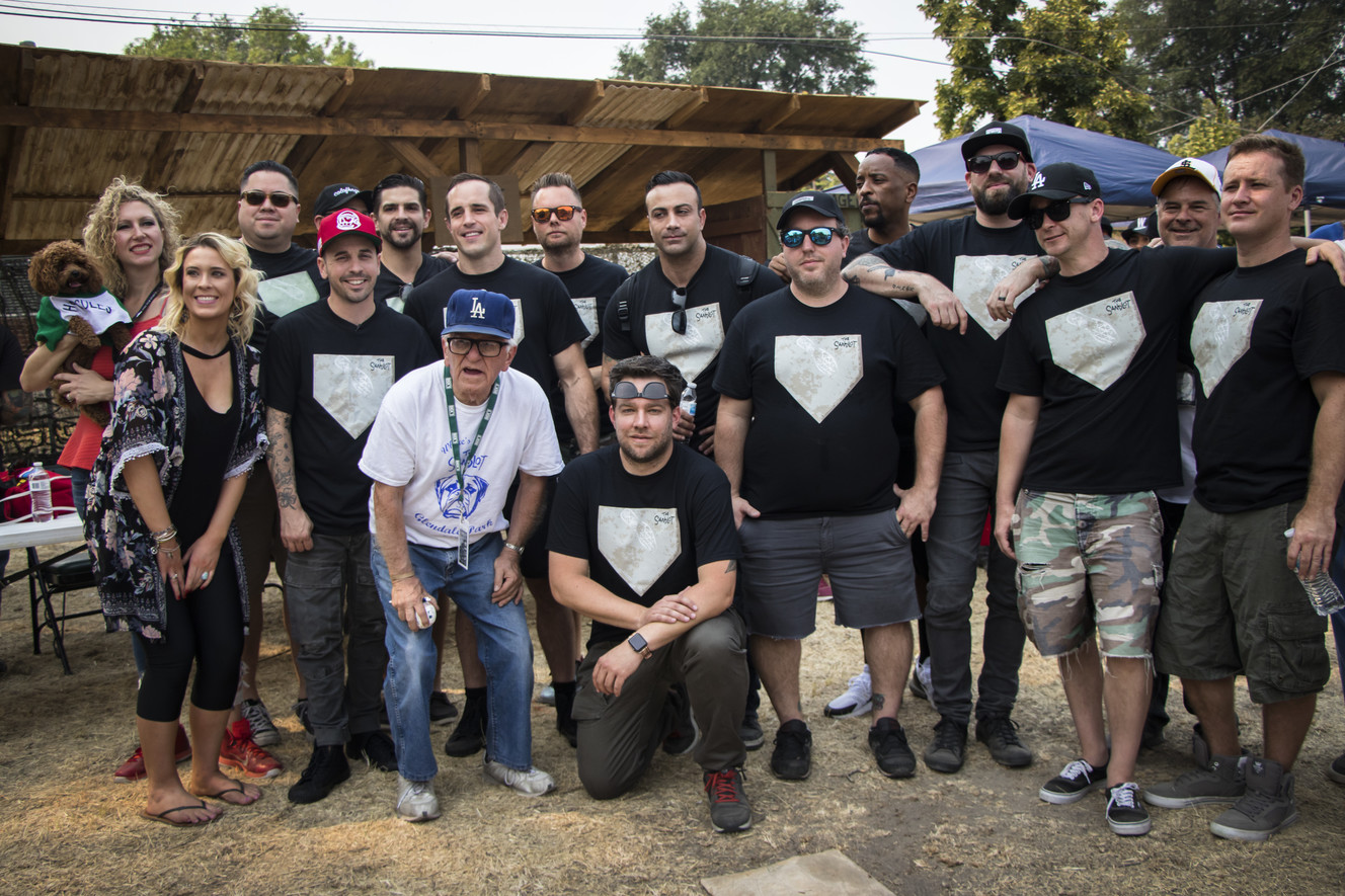 The cast members of "The Sandlot" pose for a photo with their families and members of Utah's film groups at the sandlot filming location in Salt Lake City on Saturday, Aug. 11, 2018. The movie turned 25 this year. (Photo: Carter Williams, KSL.com)