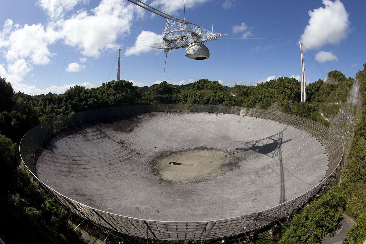 Puerto Rico's Arecibo Radio Observatory is pictured on June 14, 2010. Two BYU engineering professors have been tasked with a $5.8 million project to mount a super-antenna on the giant telescope dish originally made famous by the 1995 James Bond film "GoldenEye." (Photo: Mark A. Philbrick)