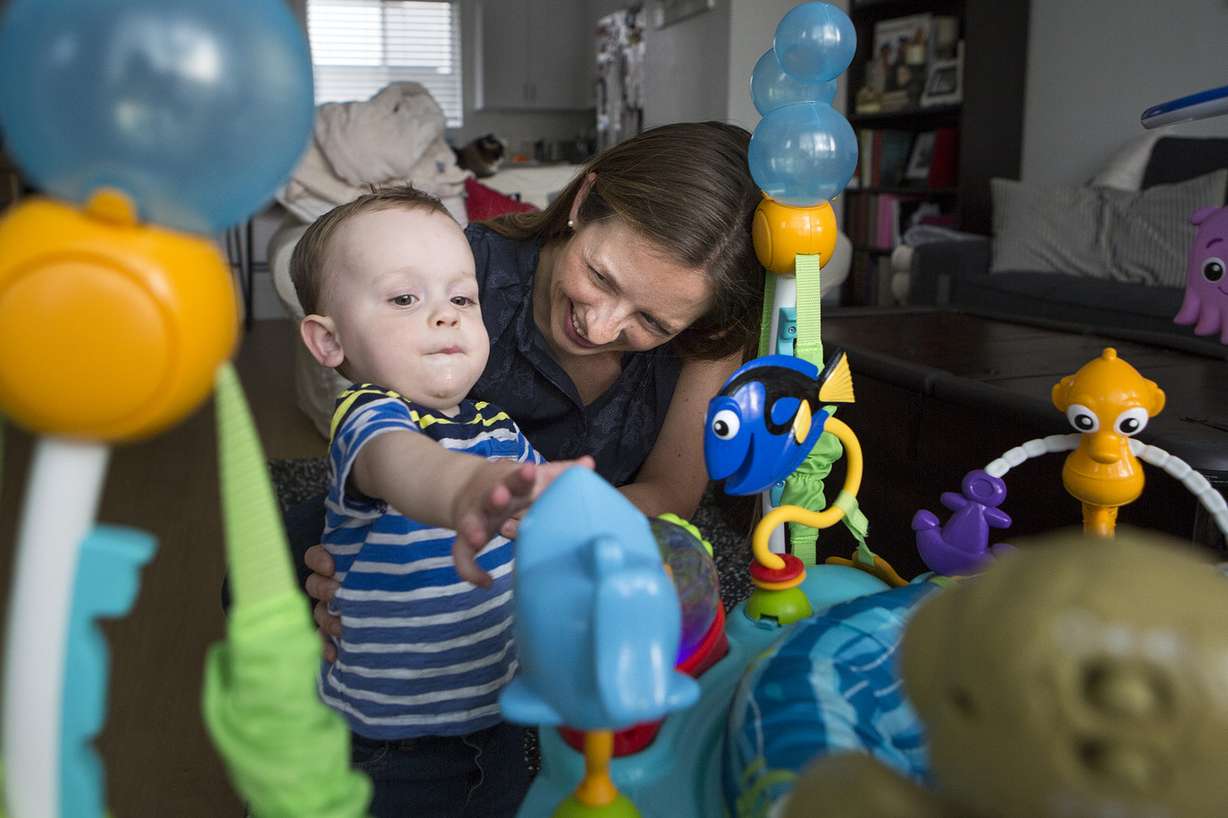 Jessica Page, an OB-GYN doctor, plays with her son Patrick "Paddy" Schrager, 11 months, at their home in Salt Lake City on Friday, Aug. 10, 2018. A new study in the New England Journal of Medicine found that inducing labor at 39 weeks reduces the risk of emergency cesarean sections for first-time moms. (Photo: James Wooldridge, KSL)
