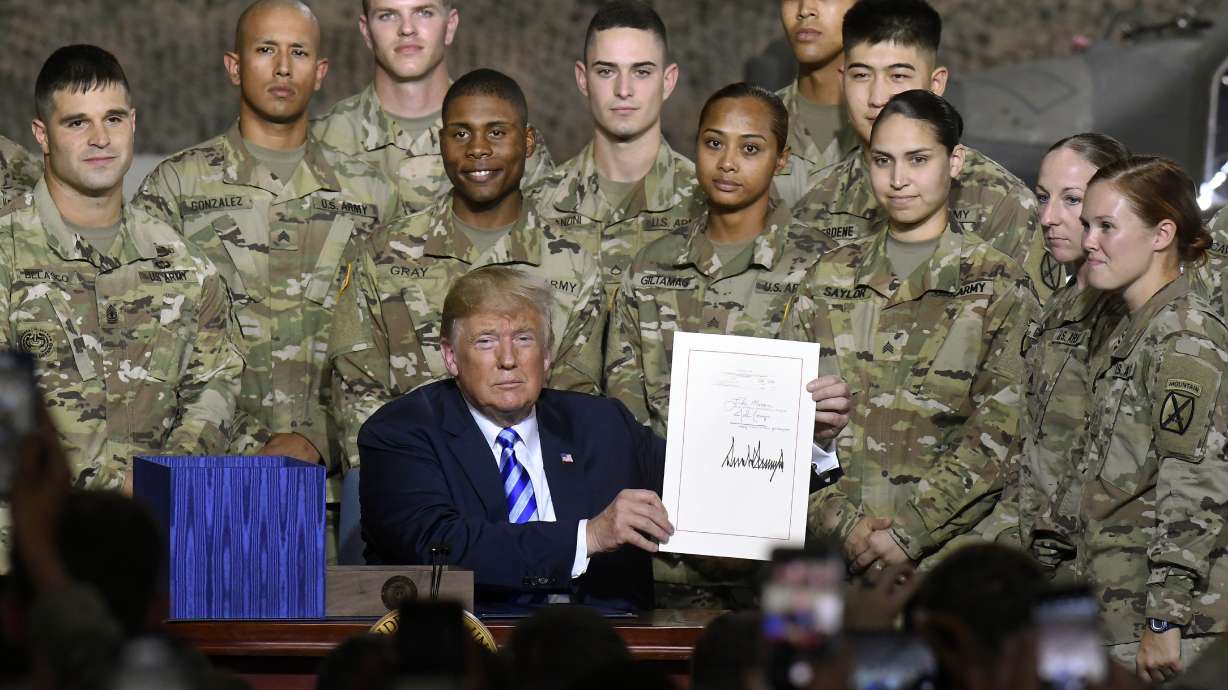 Trump signs bill named for Sen. McCain, doesn't mention him