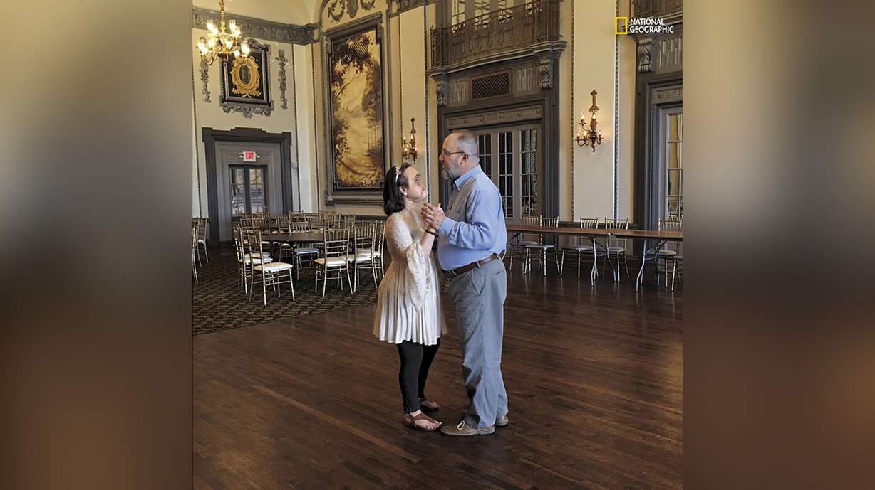 Nine months and 22 days before Katie's face transplant, at Cleveland's Tudor Arms Hotel, Katie and her father sing "Have I Told You Lately That I Love You?" as they share a dance. "Before this, I never spent so much time with my parents," said Katie, who credits their love and devotion with helping to save her life. Photo: Maggie Steber, National Geographic