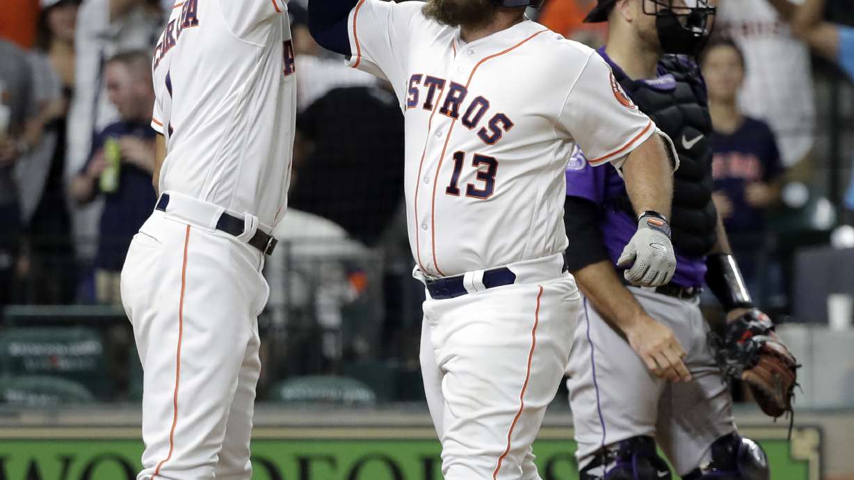 Astros hit 5 homers to end skid with 12-1 win over Rockies