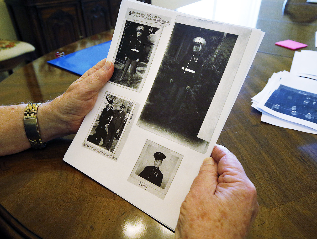 Robert J. Holmes, nephew to Marine Corps Pfc. Robert K. Holmes, shows photos of Pfc. Holmes in Draper on Thursday, Aug. 16, 2018. (Photo: Ravell Call, KSL)