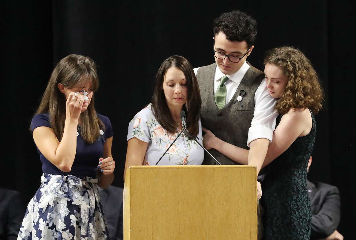 Code enforcement officer Jill Robinson's children — Katie Merrill, Jessica Knorr, Riley Merrill and Halie Merrill — speak about their mother during funeral services at the Maverik Center in West Valley City on Friday, Aug. 17, 2018. (Photo: Jeffrey D. Allred, KSL)