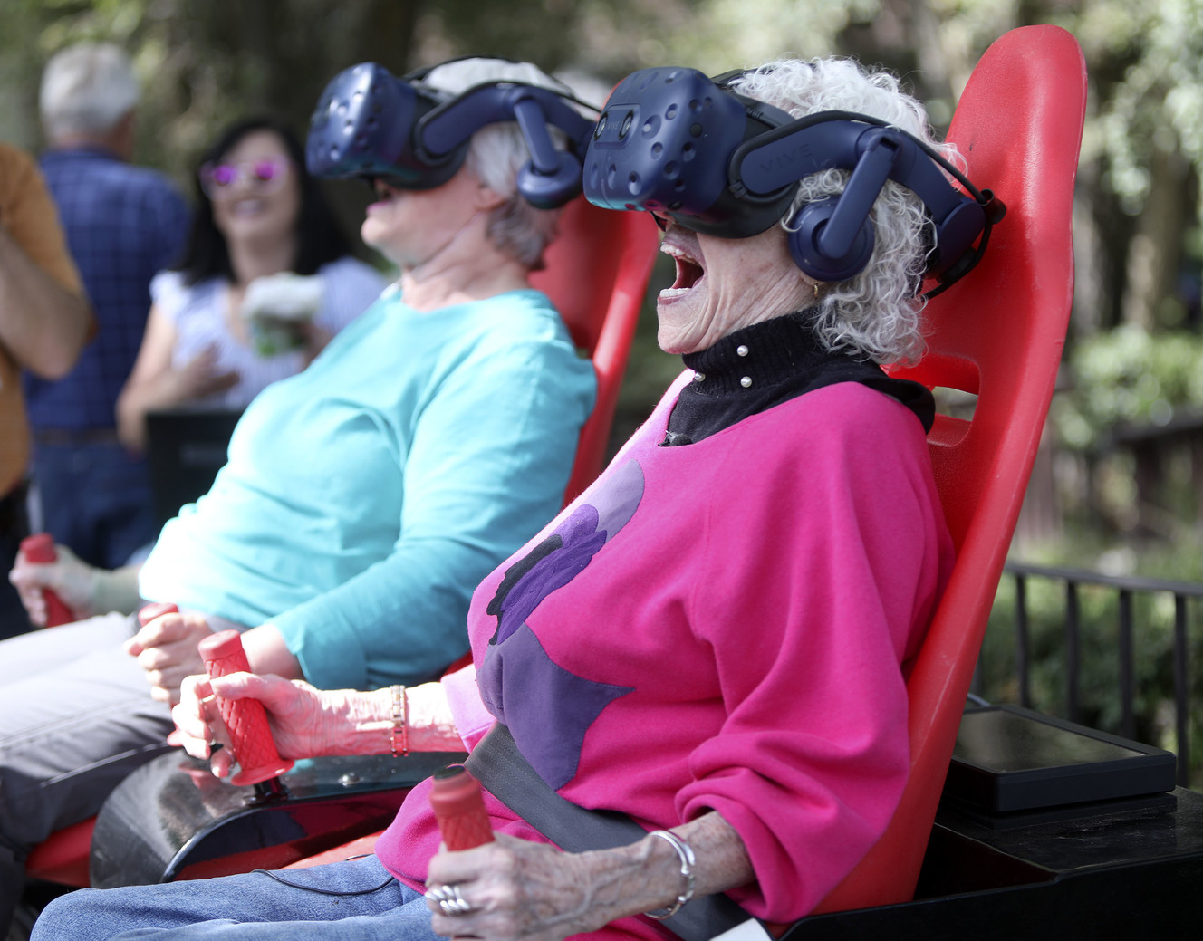 Gloria Bird, 70, and Barbara Sollie, 95, react to “Montezuma's Treasure Ride,” an Innovative Entertainment virtual reality motion ride, at Cove Point Retirement Community in Provo on Wednesday, Aug. 22, 2018. (Photo: Kristin Murphy, KSL)