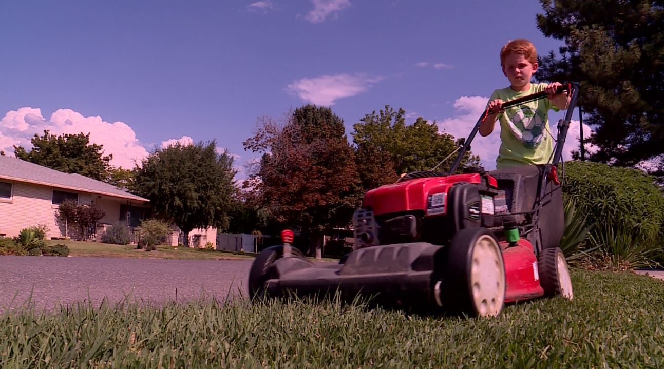 Creighton Rogers started a lawn mowing business with his older brother to help them stay active. (Photo: KSL TV)